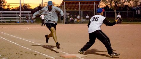 Adults playing softball