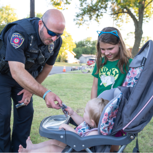 photo of police officer and kids