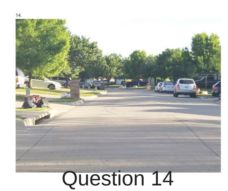 Picture of a street with trash in bags