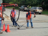 Photo of Workers paving a road